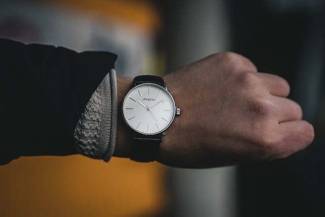person-looking-at-a-watch-on-their-wrist-checking-the-time